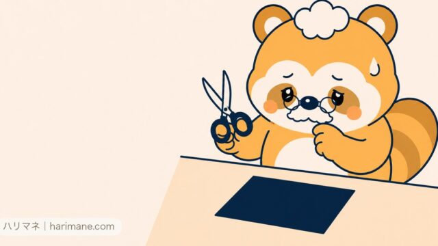 ハサミを持ってカードの前で迷うたぬ吉
